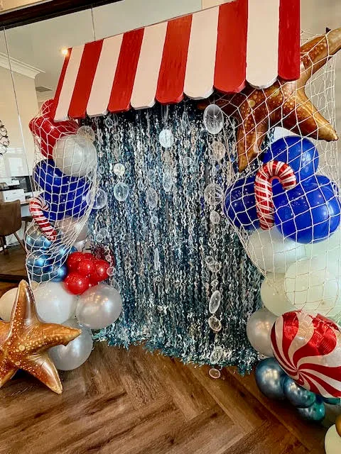 A balloon backdrop installation in pastel colors.