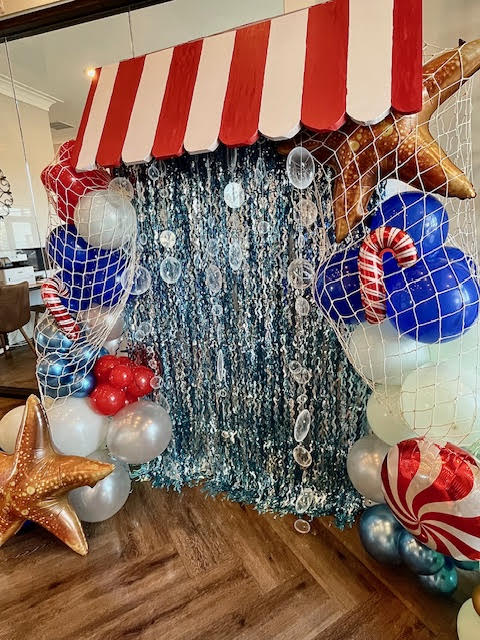 Custom paper goods and a sculptural balloon installation.